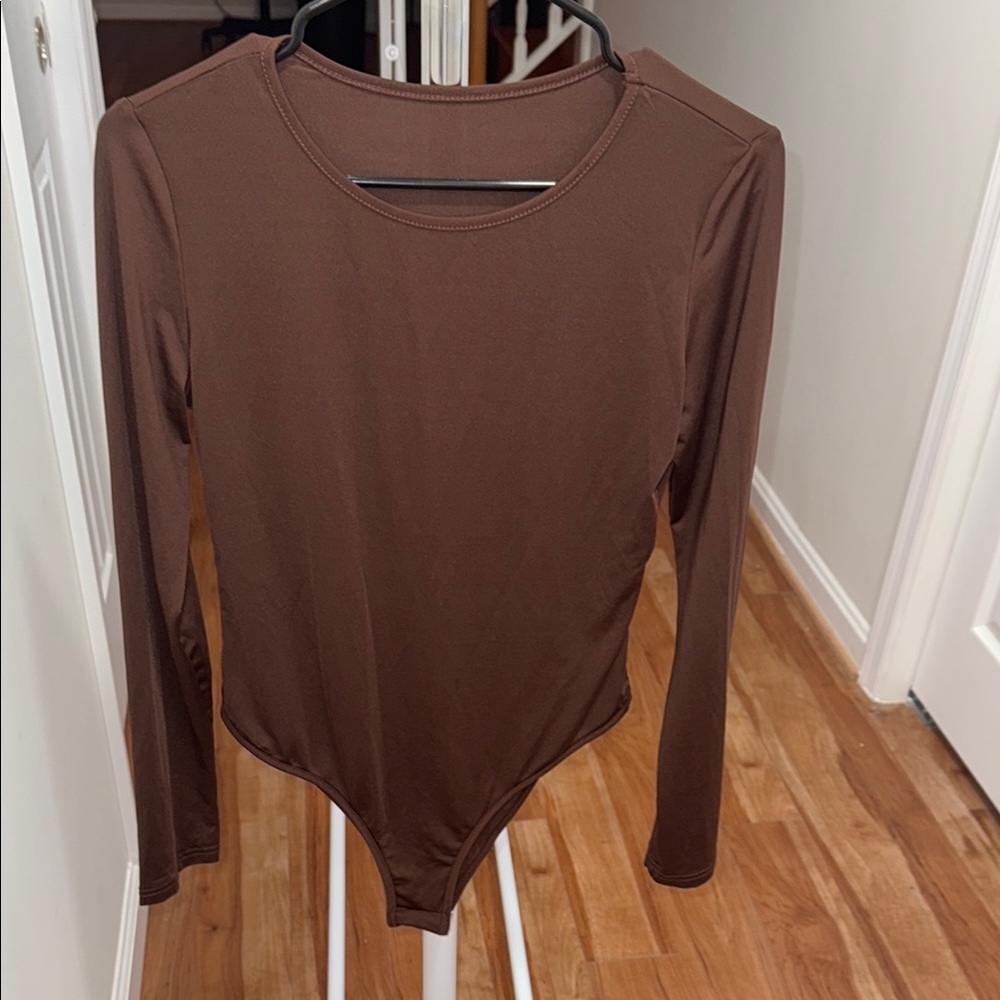 New without tag long sleeve women chocolate brown bodysuit.